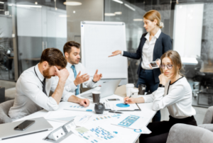 Woman exhibiting abrasive behavior with coworkers